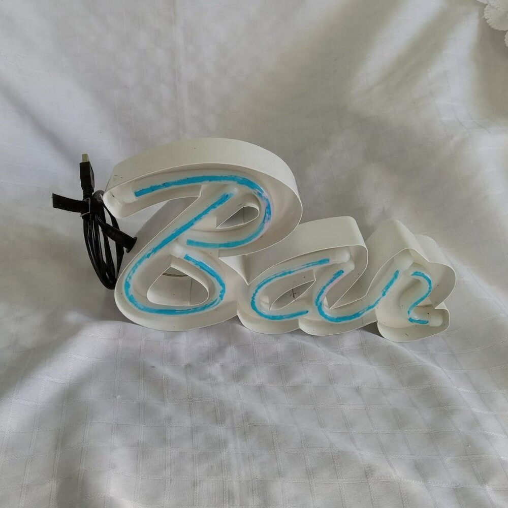 Decorative neon sign (circa 2010) and LED light strip, both USB-powered for wall